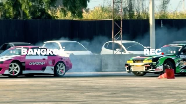 Drift cars smoking their tyres on the track